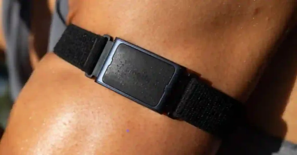 Person running outdoors while wearing the Amazfit Helio Arm Band on upper arm for fitness tracking.
